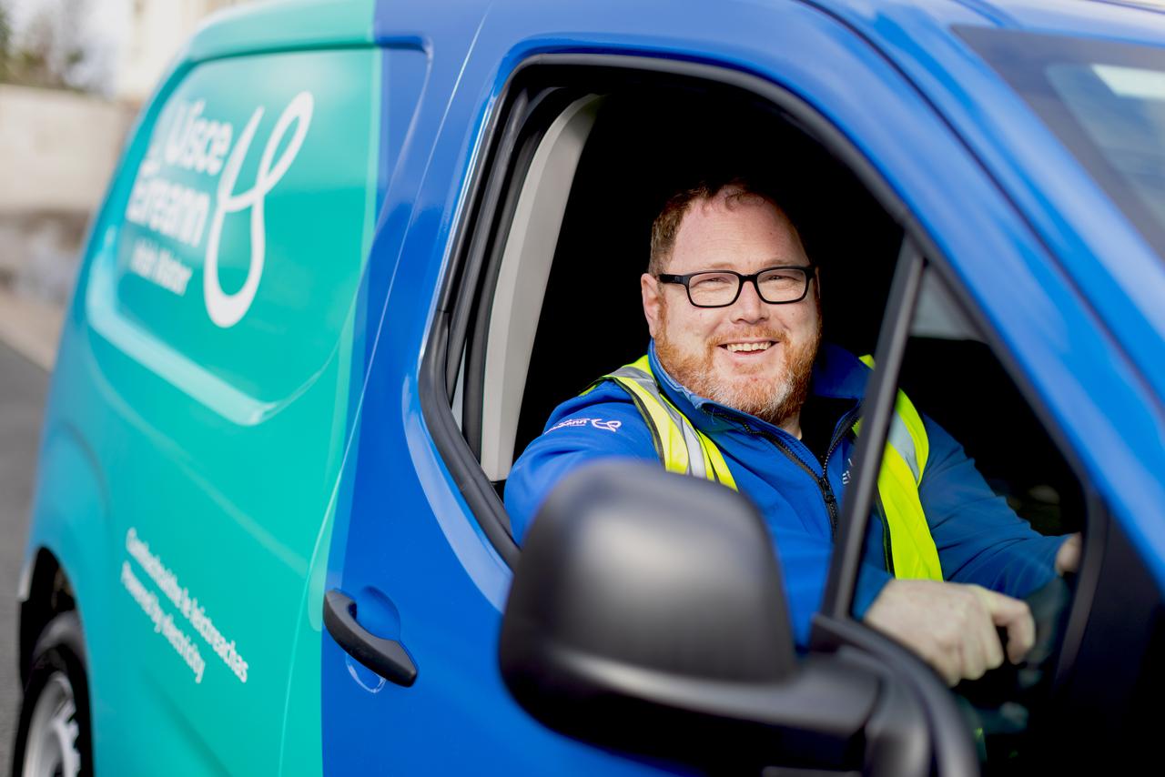 UE Employee in blue / green van
