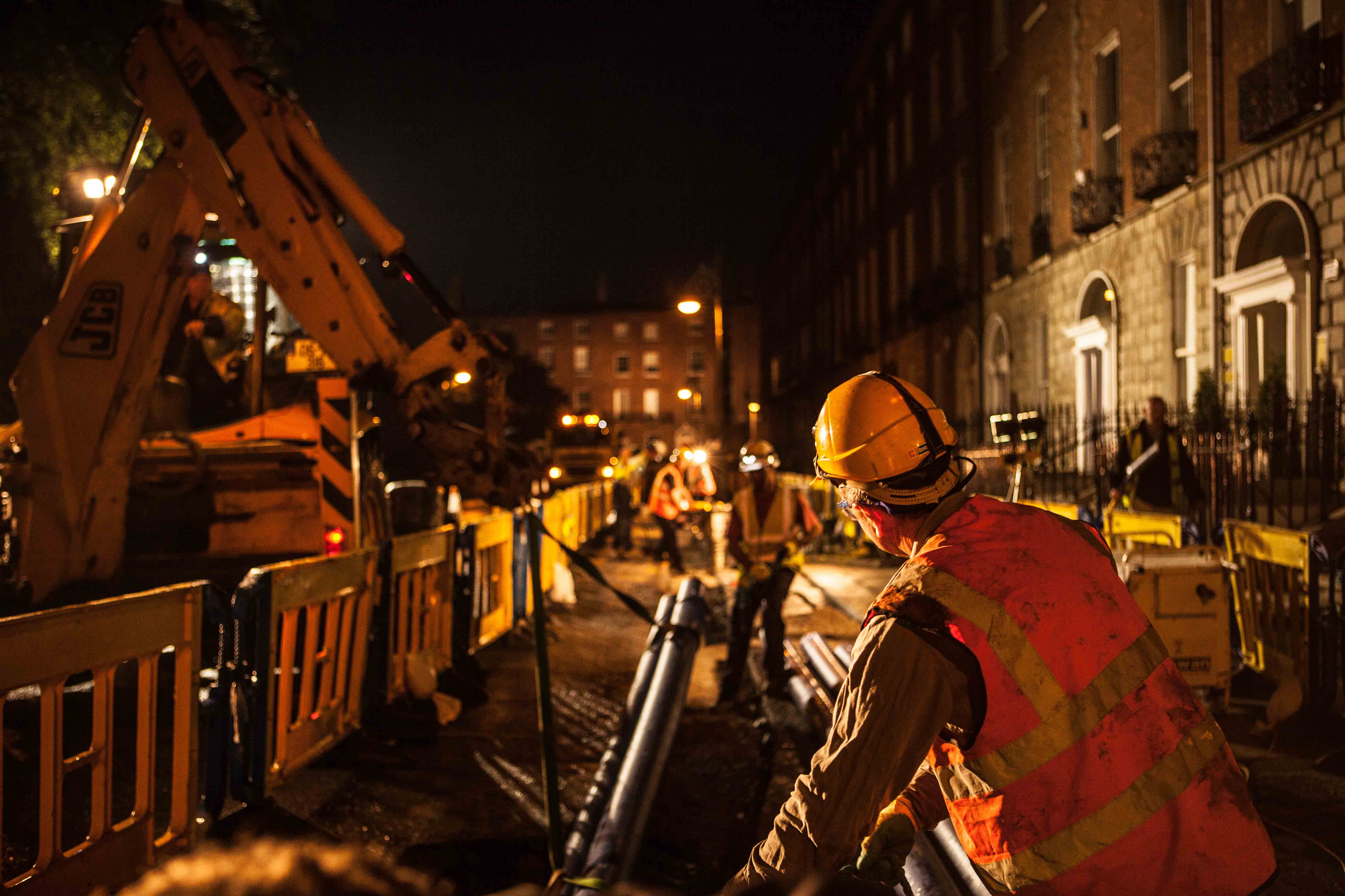 Uisce Éireann employees working with pipes at night